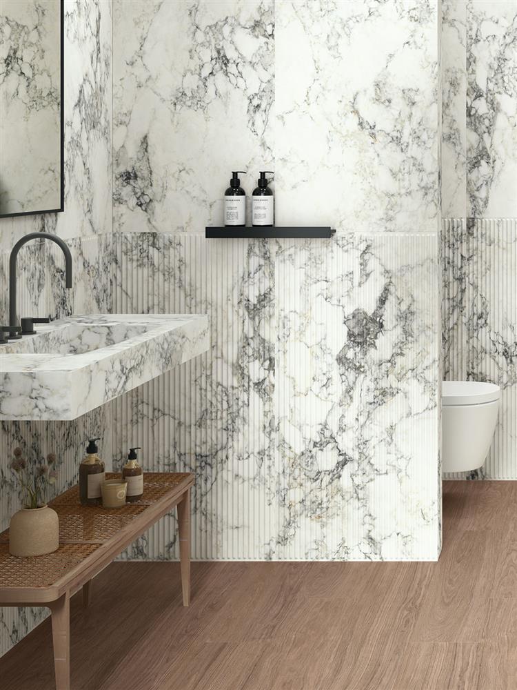 Fluted marble tiles with matching plain in a stylish modern bathroom